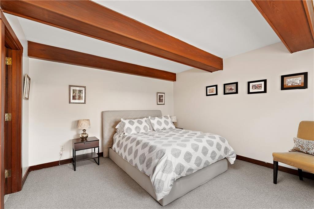 178 Backbone Road Sewickley, PA 15143 - Photo 10 of 25 a bedroom with a bed and chair