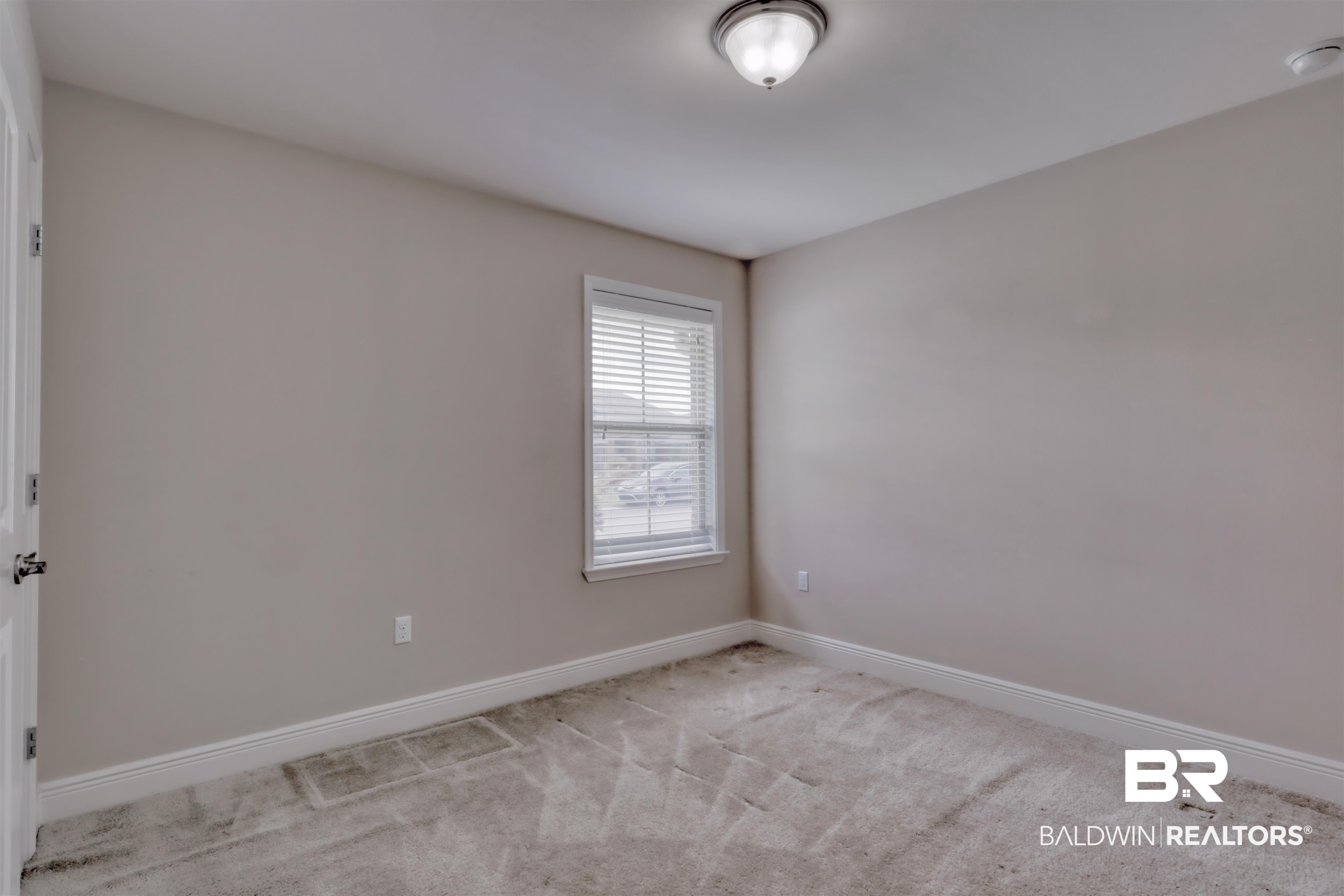 14794 Troon Drive Foley, AL 36535 - Photo 18 of 33 Spare room with baseboards and carpet flooring
