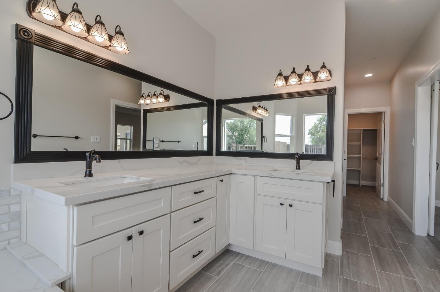 684 South Mohler Road Ripon, CA 95366 - Photo 29 of 41 a spacious bathroom with a double vanity sink and a mirror