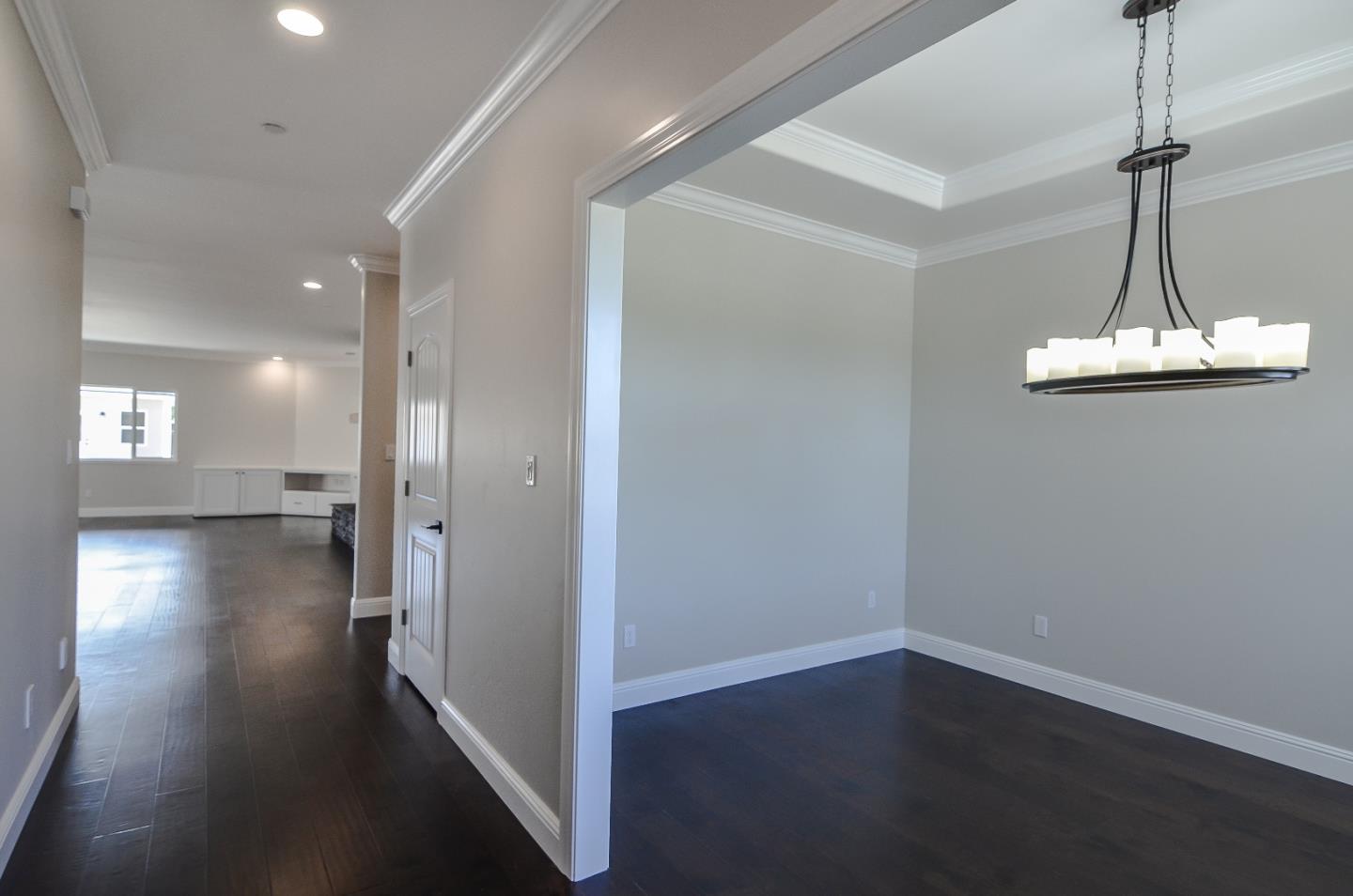 684 South Mohler Road Ripon, CA 95366 - Photo 5 of 41 a view of a hallway with wooden floor
