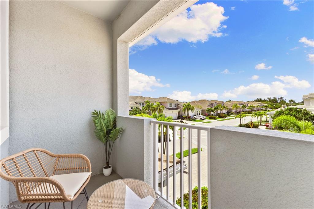 4607 Arboretum Circle, Unit 202 Naples, FL 34112 - Photo 13 of 39 a view of a balcony with furniture