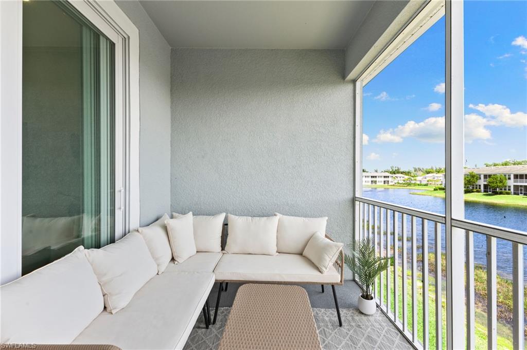 4607 Arboretum Circle, Unit 202 Naples, FL 34112 - Photo 30 of 39 a balcony view with a couch