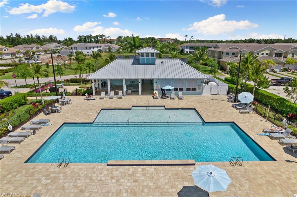 4607 Arboretum Circle, Unit 202 Naples, FL 34112 - Photo 39 of 39 a view of a house with a big yard