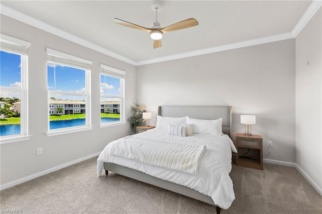 4607 Arboretum Circle, Unit 202 Naples, FL 34112 - Photo 7 of 39 a bedroom with a bed ceiling fan and window