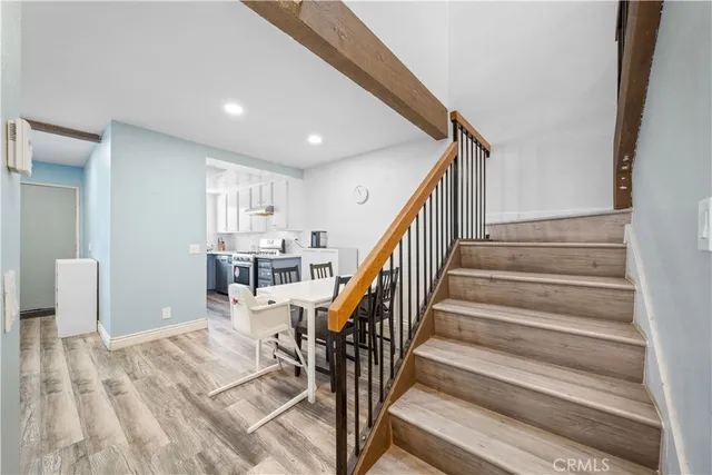 a bedroom with furniture and a wooden floor