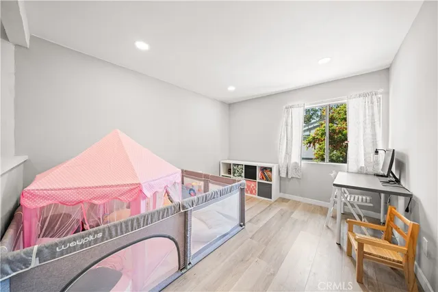 a bedroom with a bed and a table