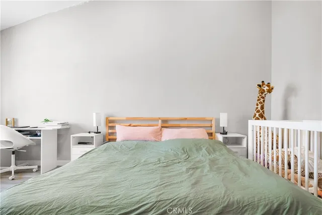a view of a swimming pool with a lawn chairs under an umbrella