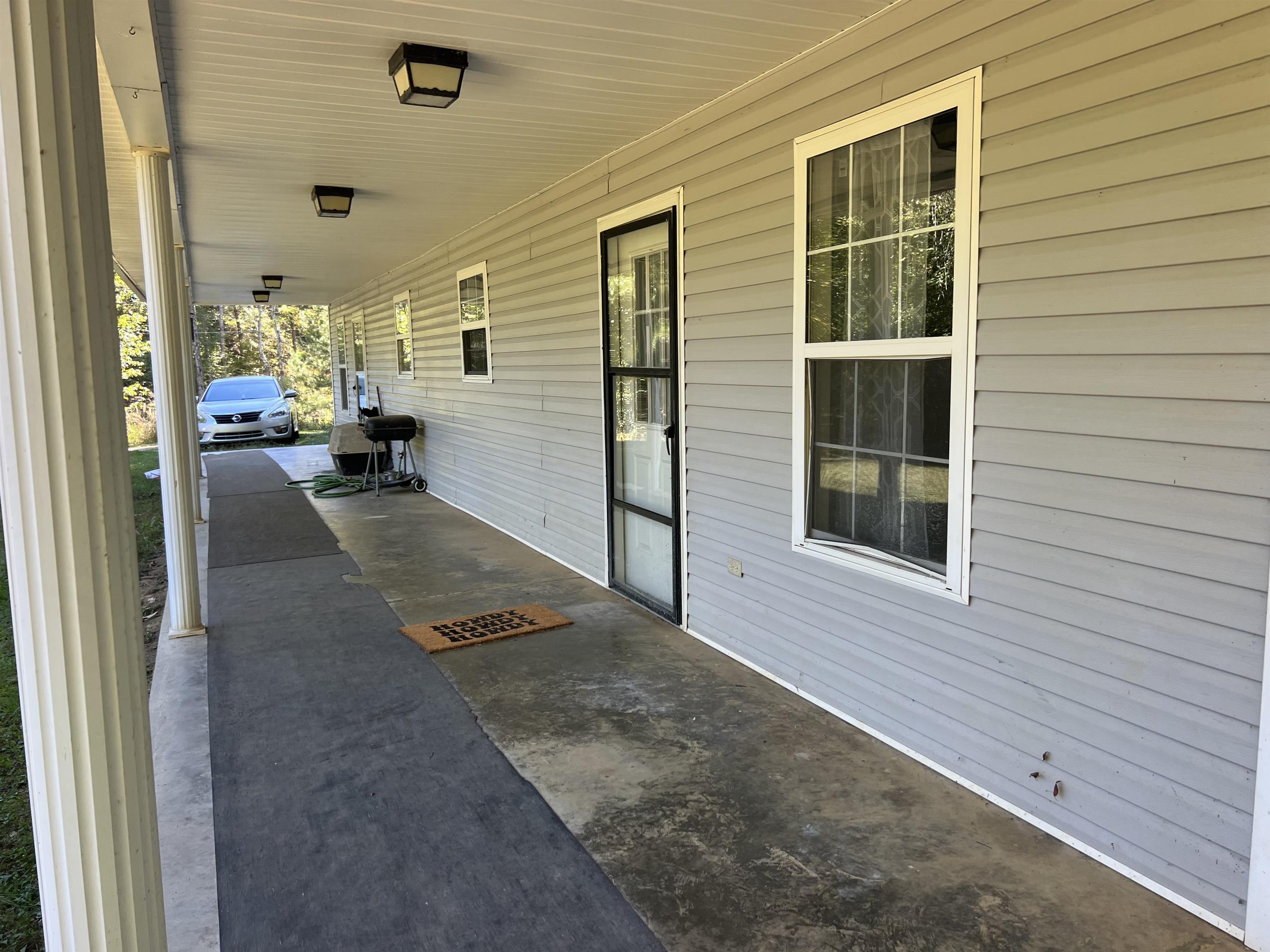 180-150 Burks Road Savannah, TN 38372 - Photo 8 of 11 a view of a porch with a table and chairs
