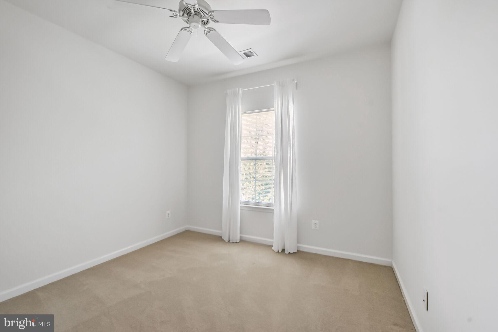 42952 Miltec Terrace Chantilly, VA 20152 - Photo 15 of 30 a view of an empty room with a window