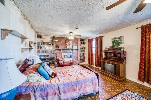 a bed room with a bed and a tv