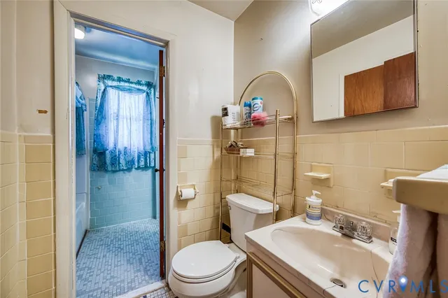 a bathroom with a toilet a sink and shower