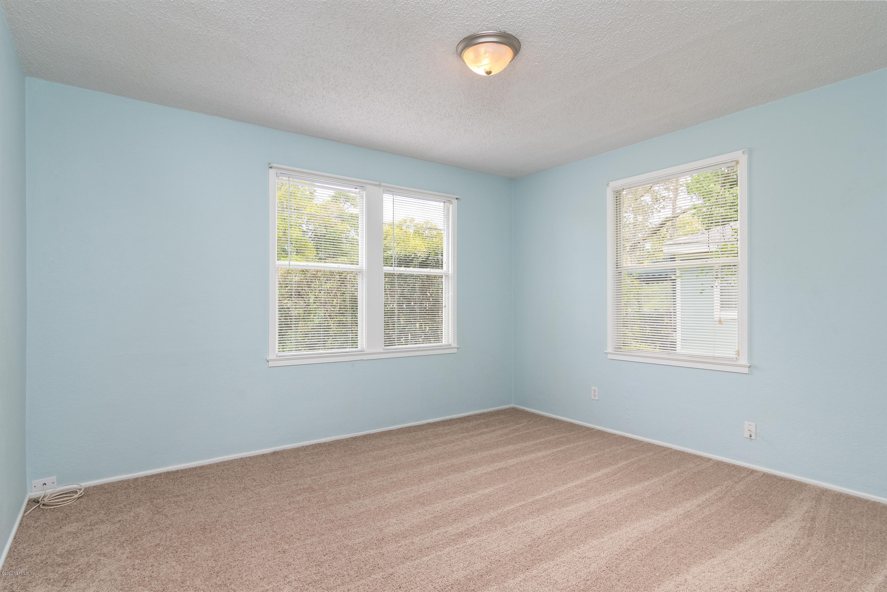 1790 Mayfair Road Jacksonville, FL 32207 - Photo 15 of 25 an empty room with a window