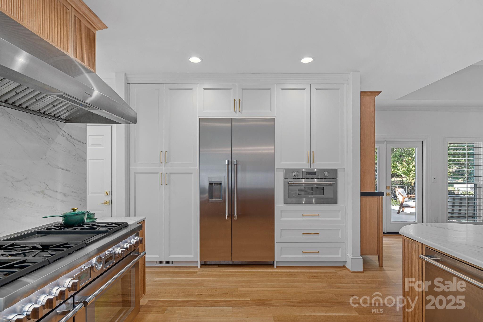 18613 John Connor Road Cornelius, NC 28031 - Photo 11 of 48 a kitchen with stainless steel appliances granite countertop a refrigerator and a stove