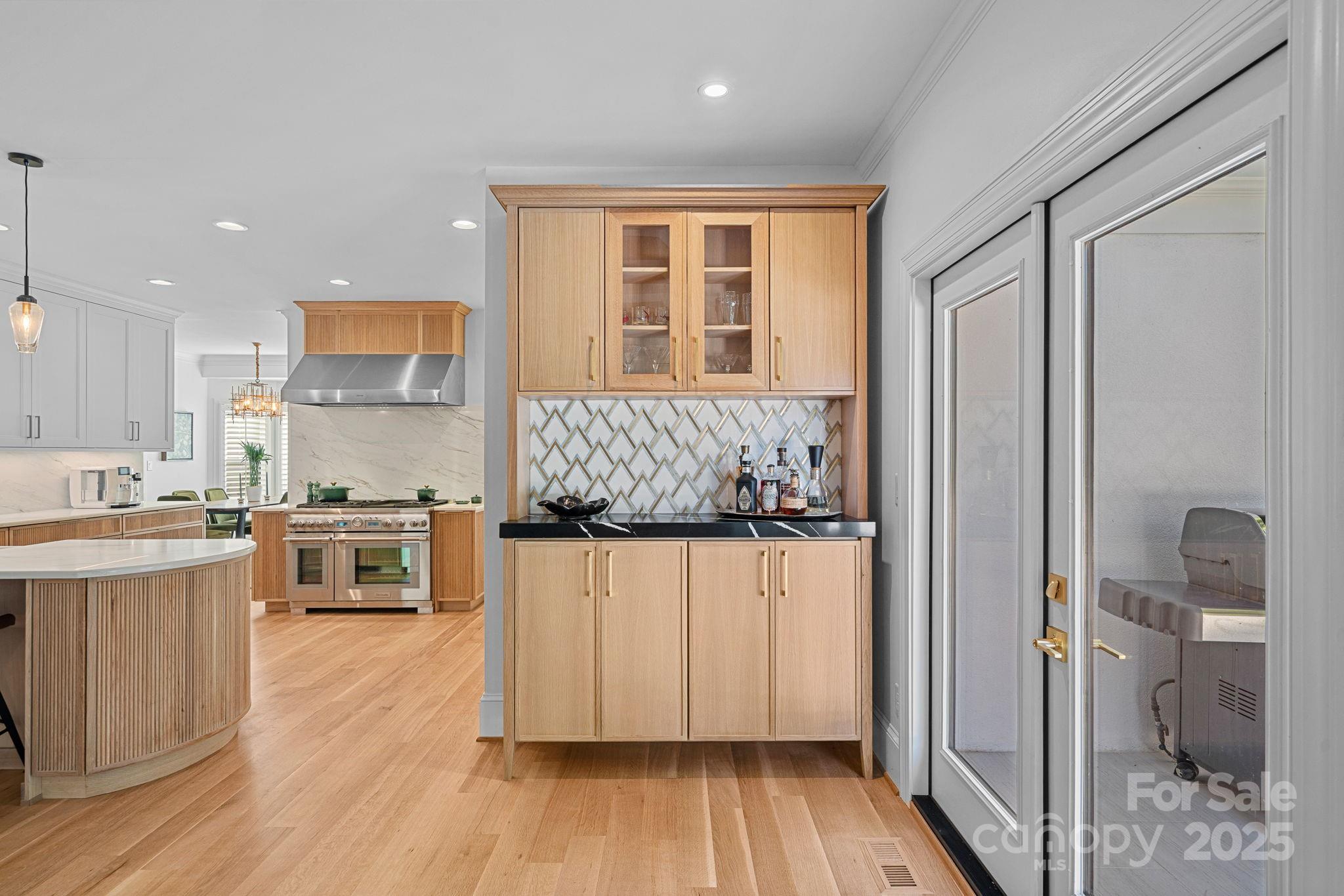 18613 John Connor Road Cornelius, NC 28031 - Photo 14 of 48 a kitchen with a refrigerator and cabinets