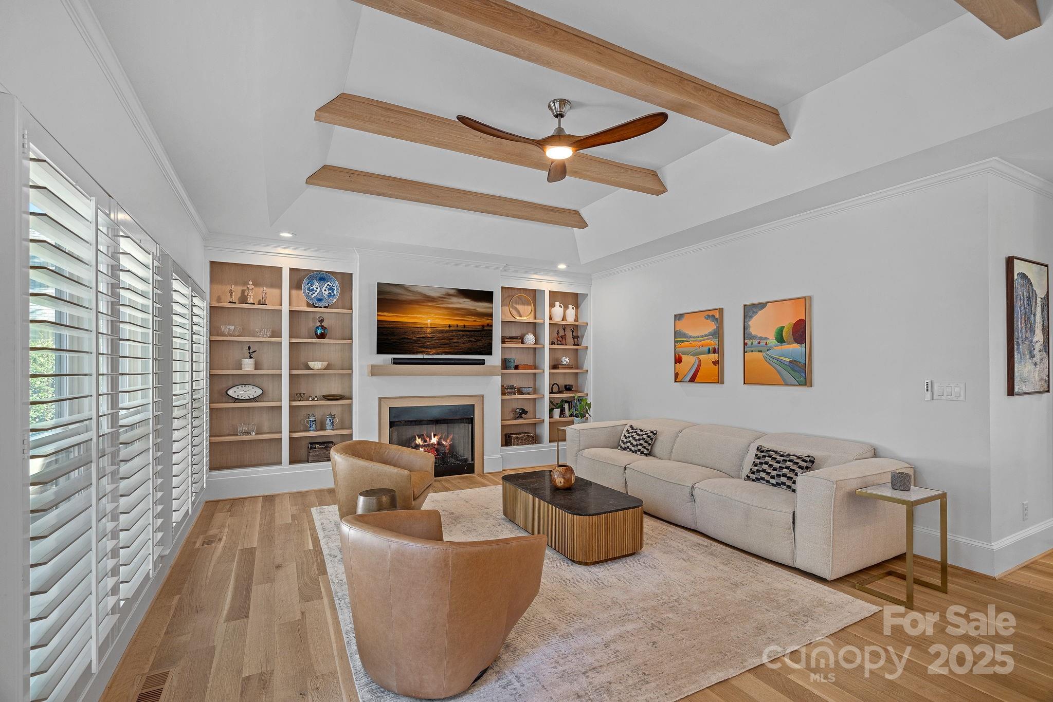 18613 John Connor Road Cornelius, NC 28031 - Photo 15 of 48 a living room with furniture and a flat screen tv