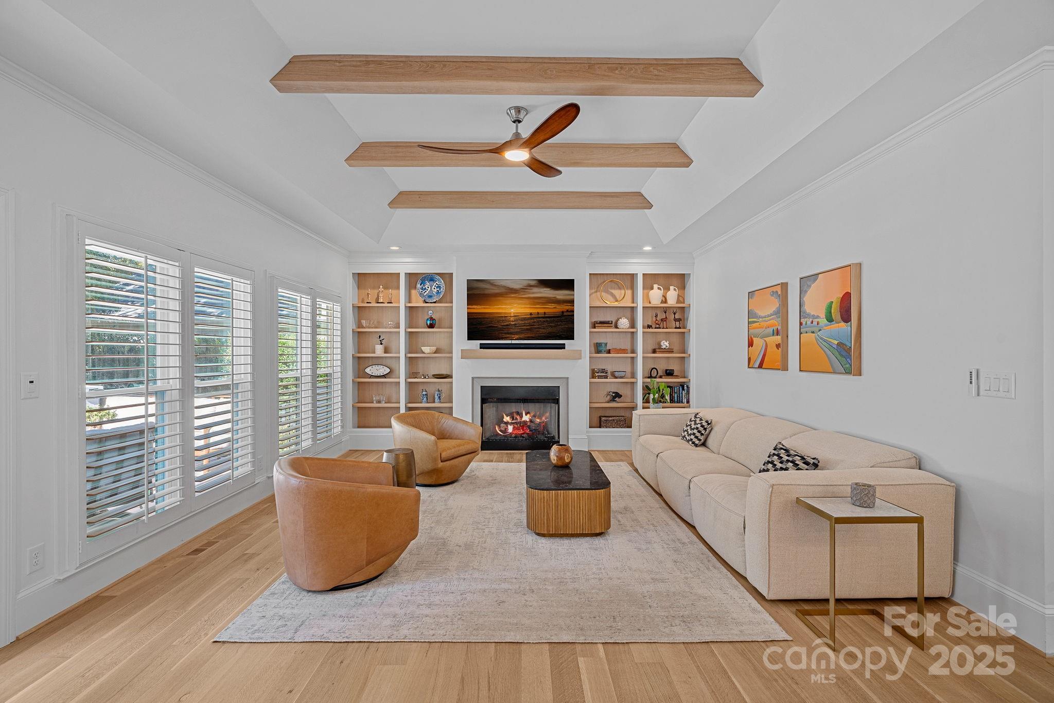 18613 John Connor Road Cornelius, NC 28031 - Photo 16 of 48 a living room with furniture and a fireplace