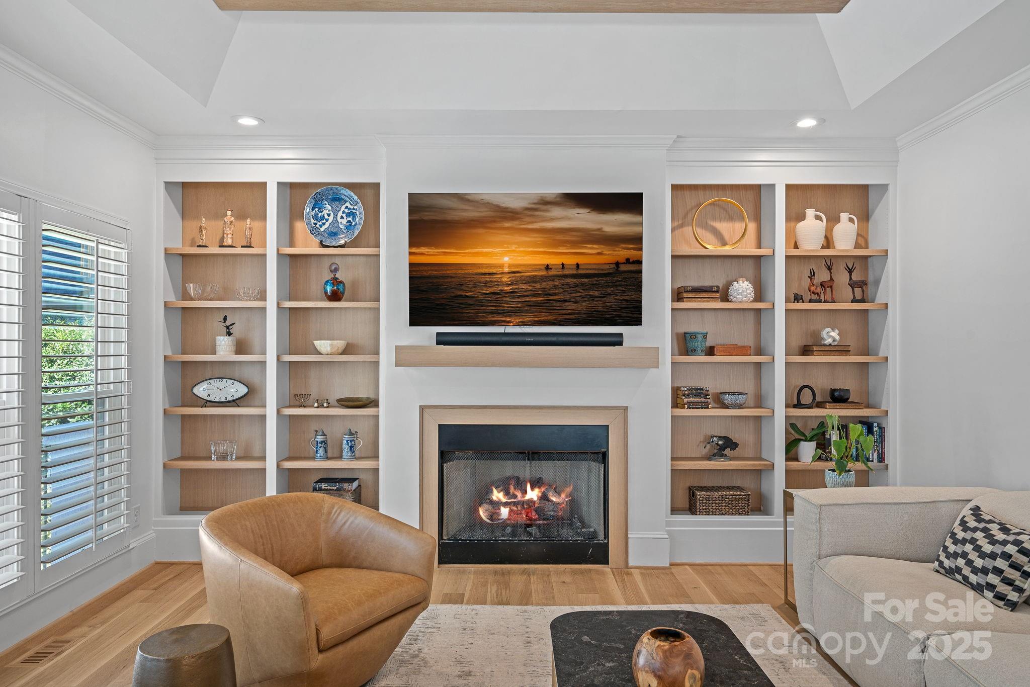 18613 John Connor Road Cornelius, NC 28031 - Photo 17 of 48 a living room with furniture a flat screen tv and a fireplace