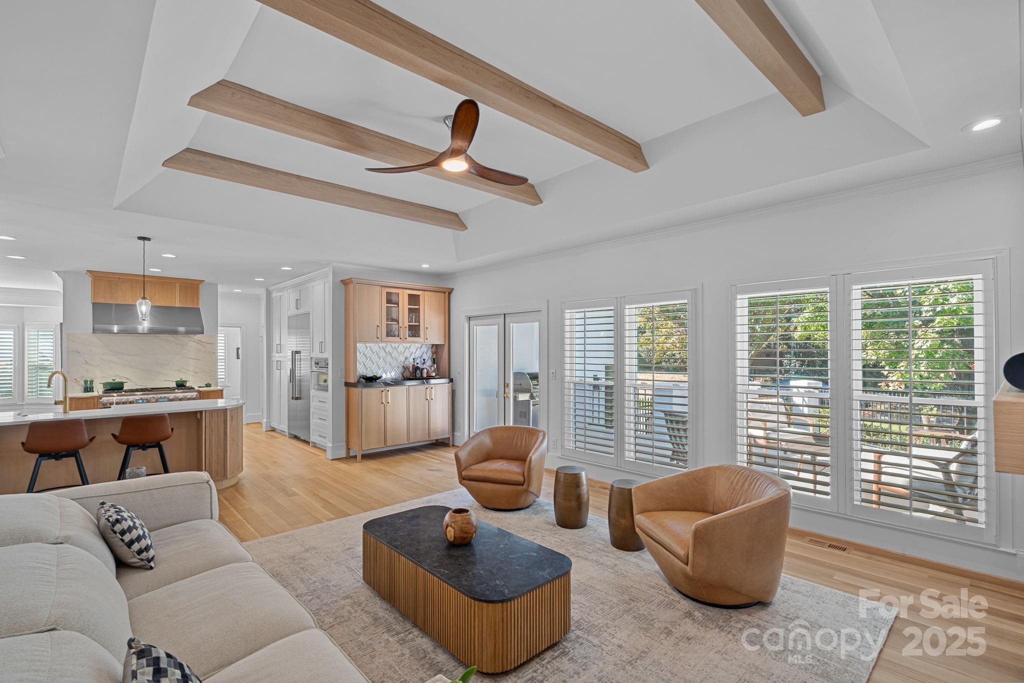 18613 John Connor Road Cornelius, NC 28031 - Photo 18 of 48 a living room with furniture ceiling fan and a large window