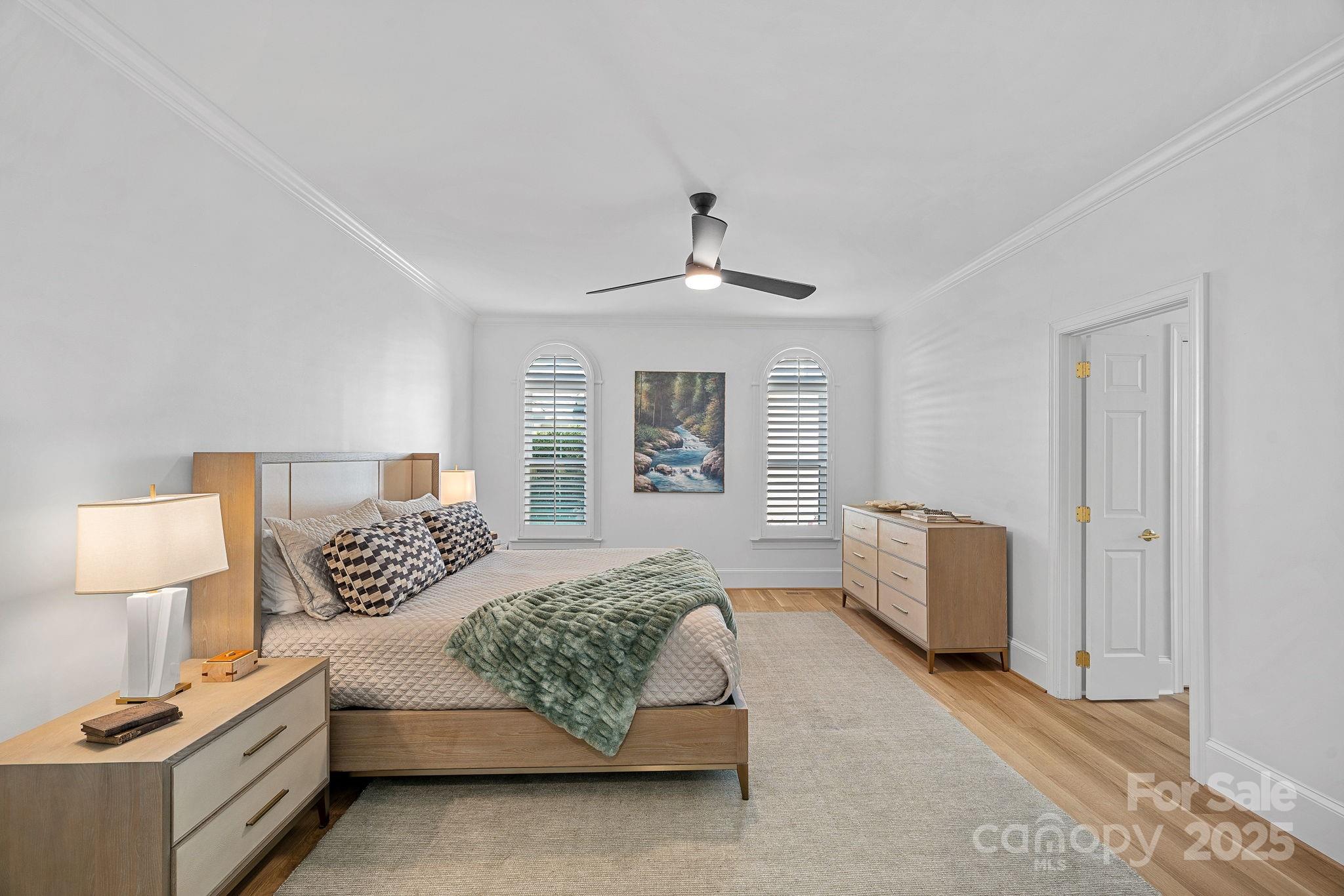 18613 John Connor Road Cornelius, NC 28031 - Photo 21 of 48 a bedroom with a bed and a lamp on table