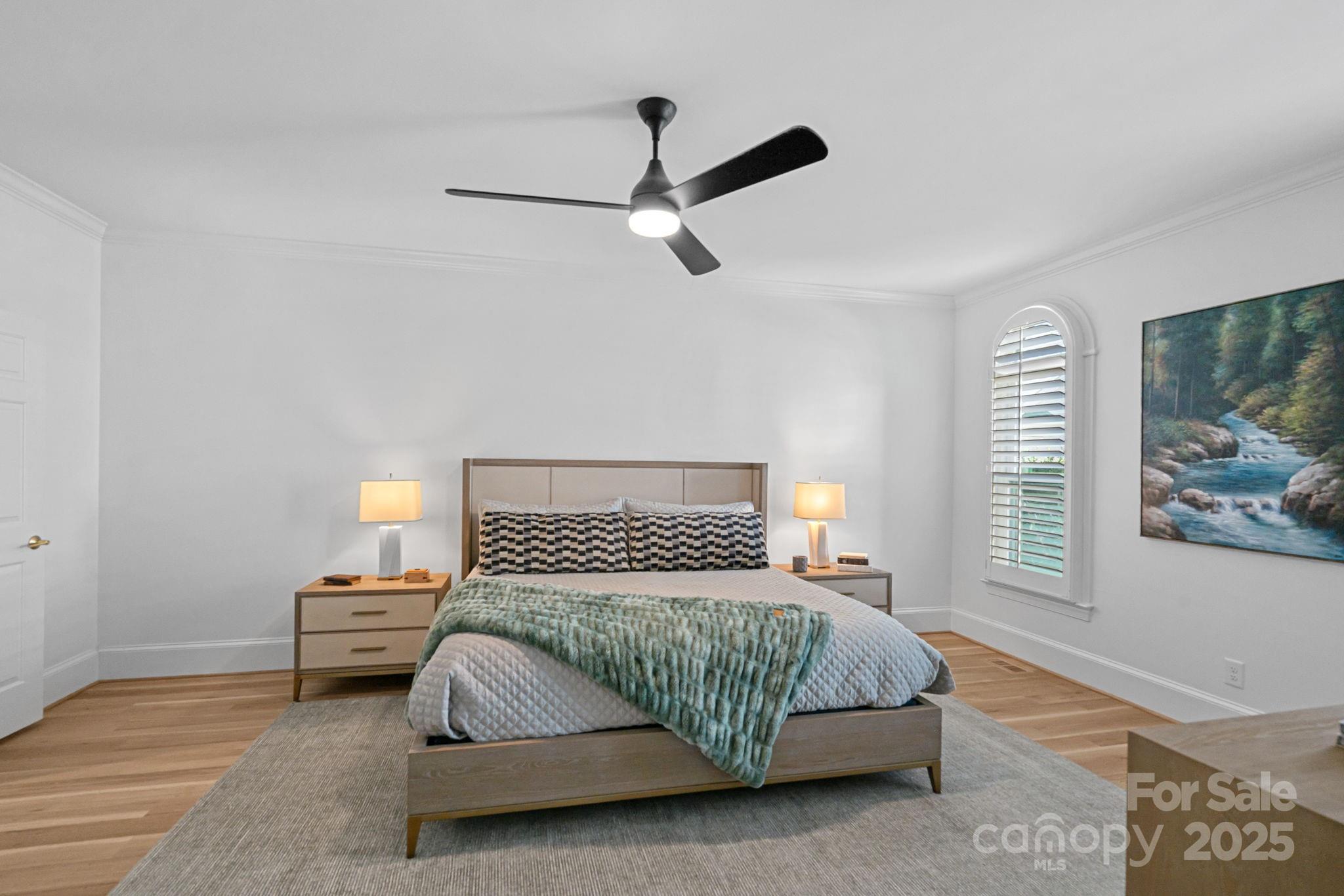 18613 John Connor Road Cornelius, NC 28031 - Photo 22 of 48 a bedroom with a bed and wooden floor