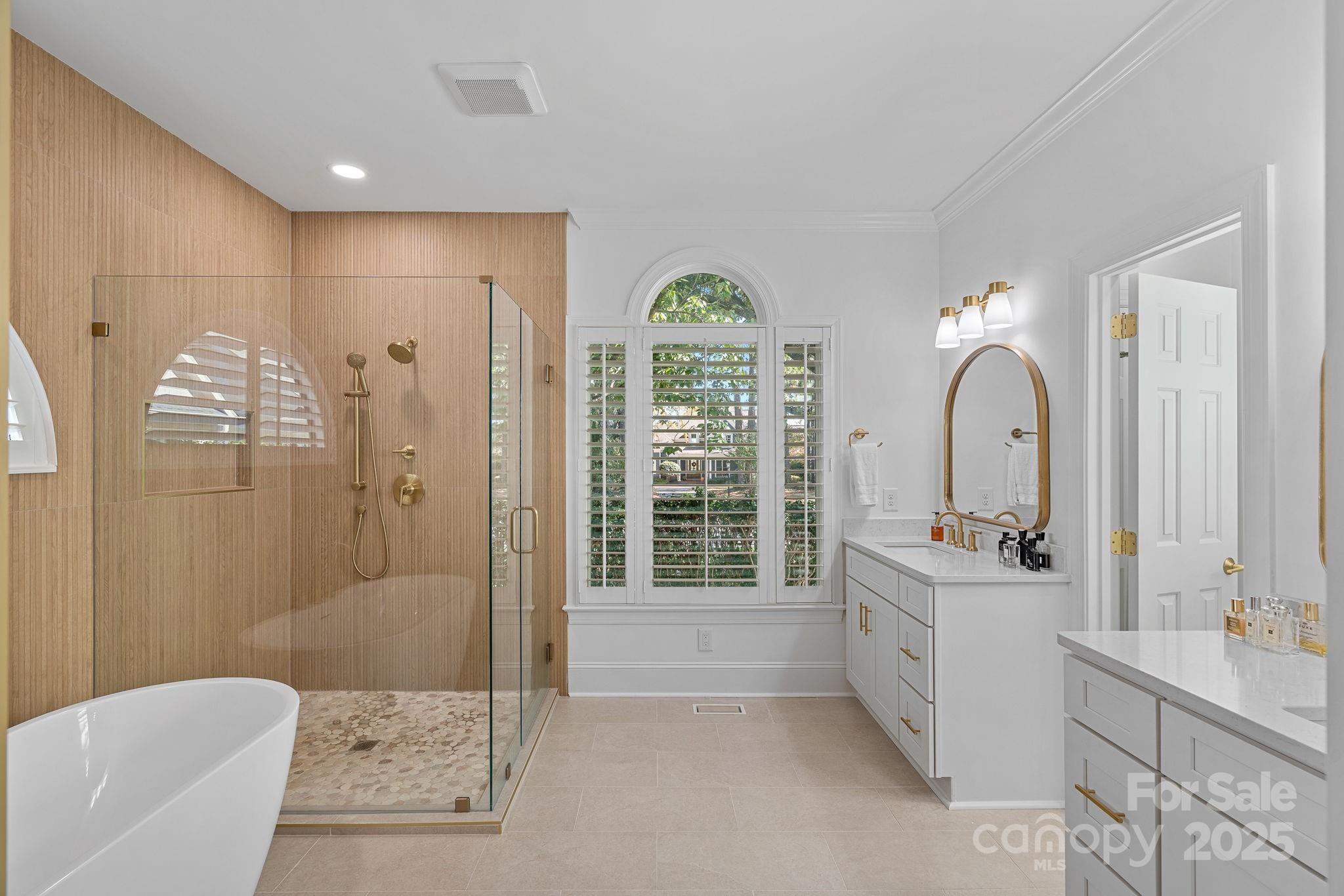 18613 John Connor Road Cornelius, NC 28031 - Photo 23 of 48 a view of a bathroom with a tub shower and sink