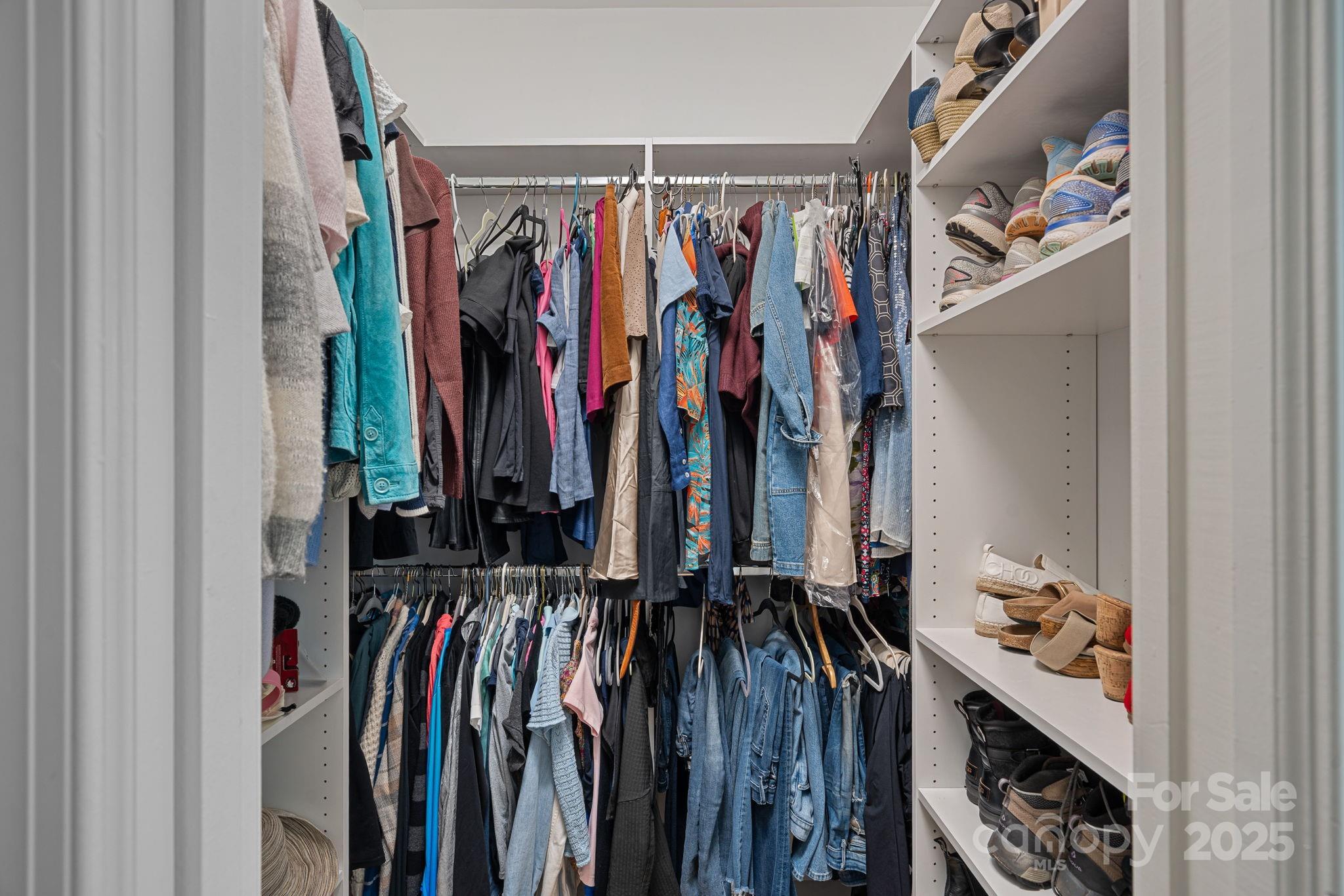 18613 John Connor Road Cornelius, NC 28031 - Photo 26 of 48 a view of walk in closet with clothes