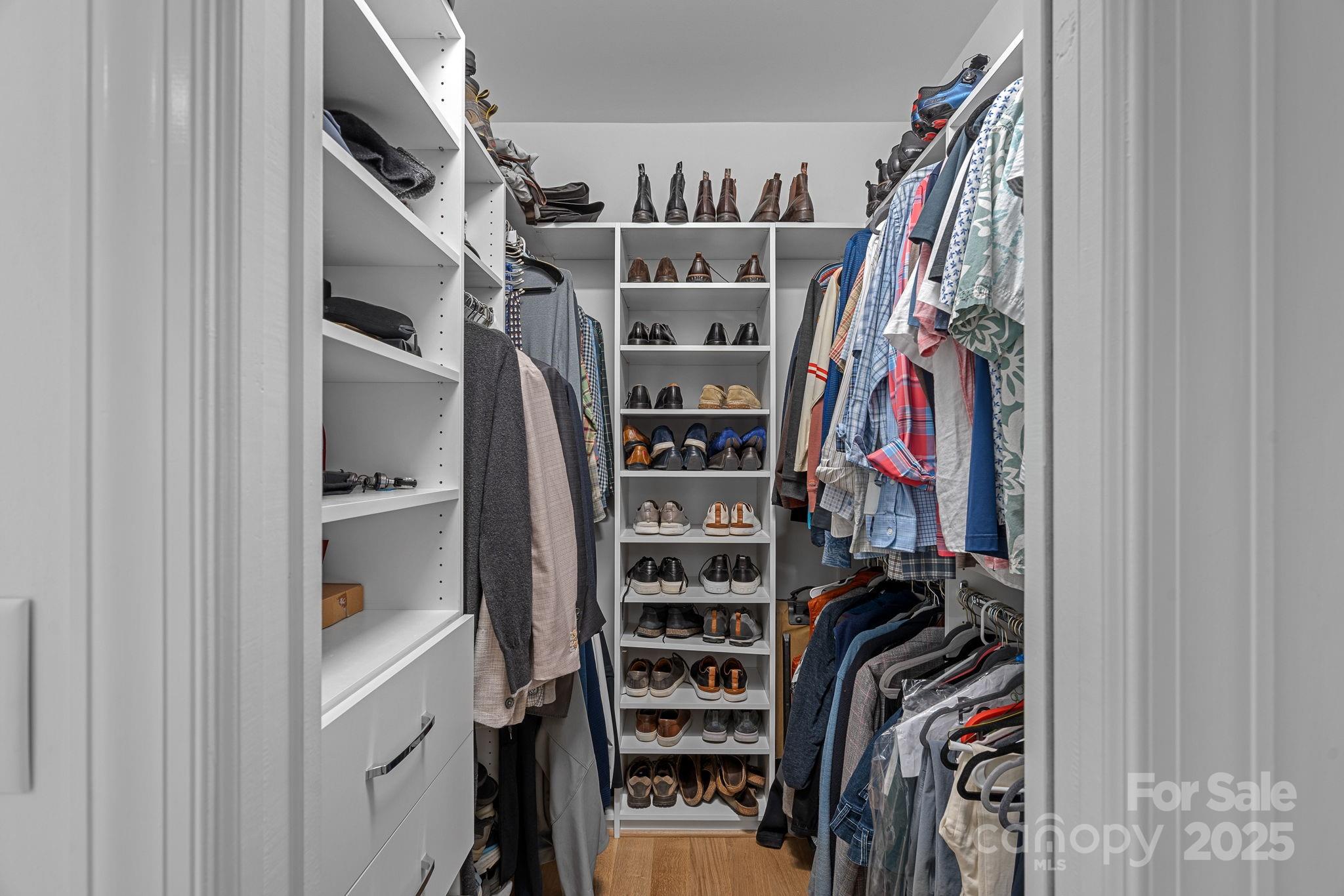 18613 John Connor Road Cornelius, NC 28031 - Photo 27 of 48 a view of walk in closet with clothes and shoes