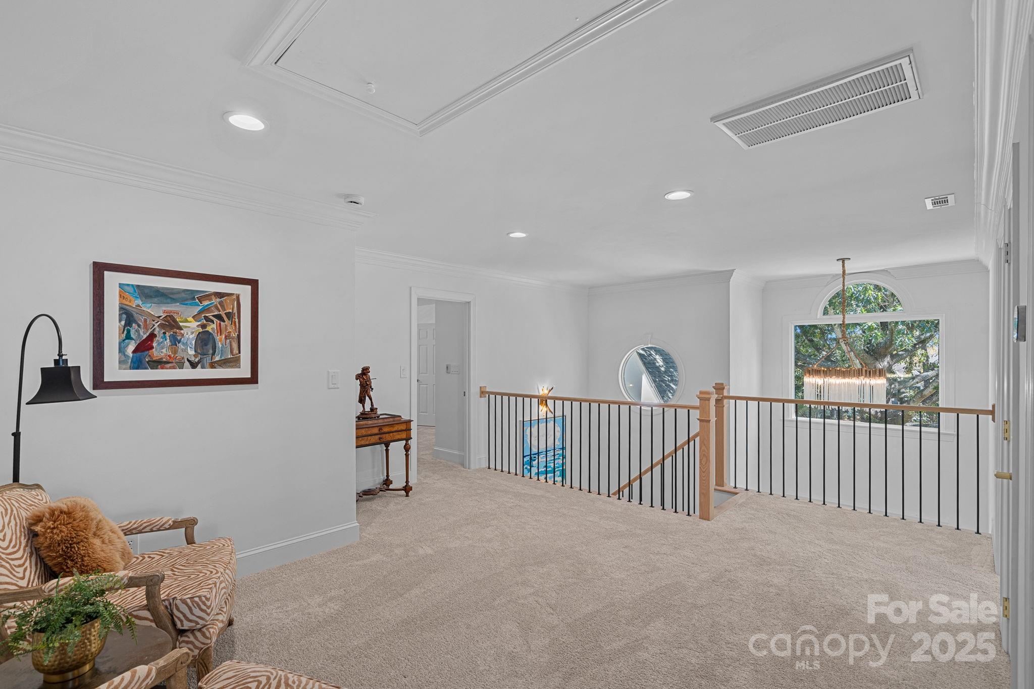 18613 John Connor Road Cornelius, NC 28031 - Photo 30 of 48 a view of a livingroom with furniture windows cabinet and hallway