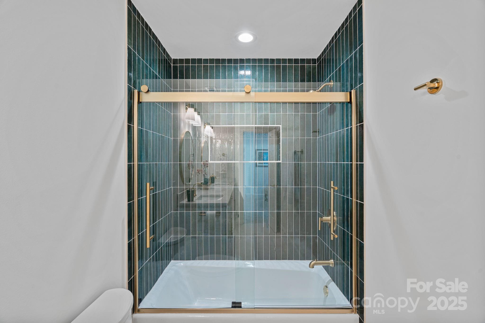 18613 John Connor Road Cornelius, NC 28031 - Photo 34 of 48 a bathroom with a shower and a sink