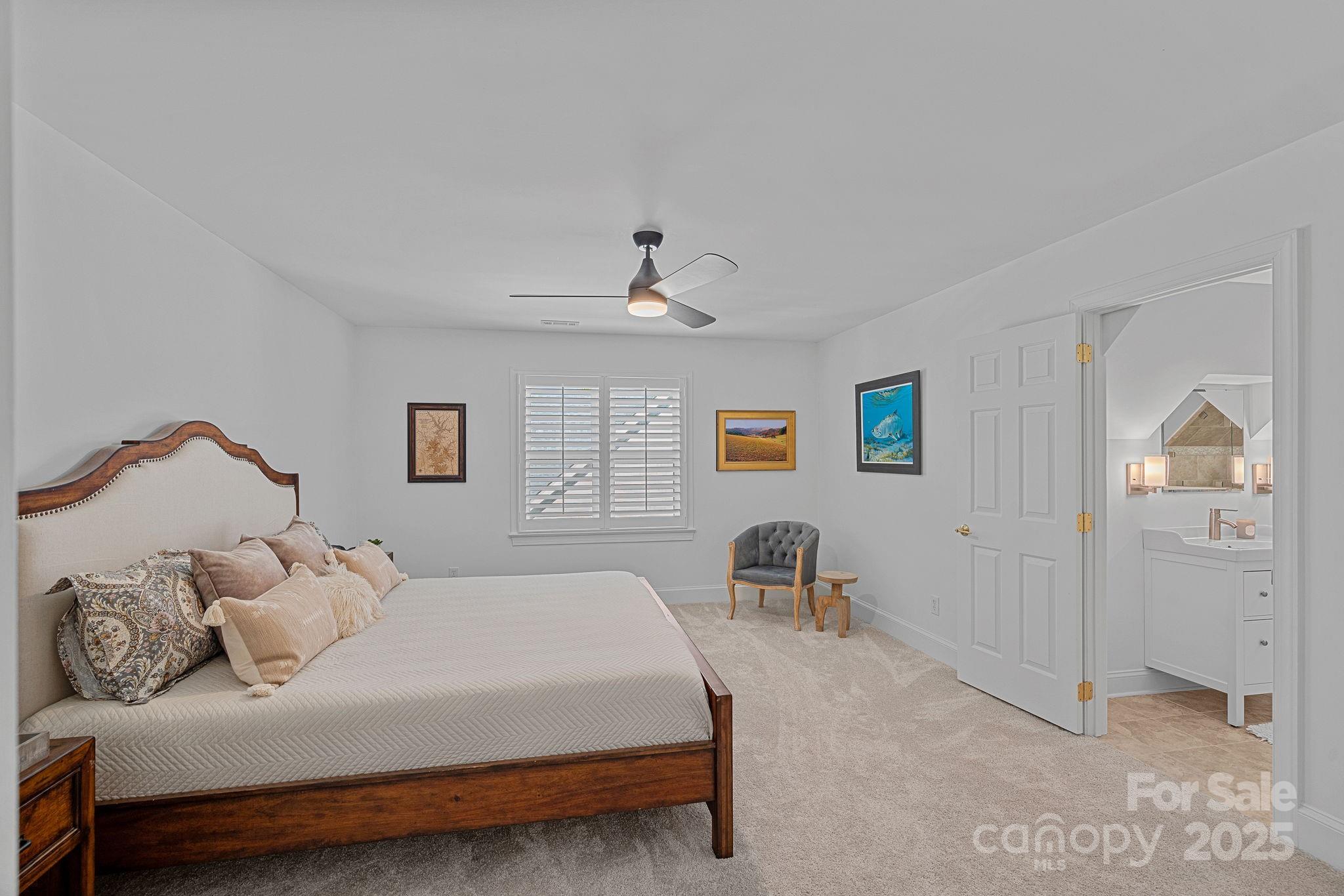 18613 John Connor Road Cornelius, NC 28031 - Photo 38 of 48 a bedroom with a bed and a chair