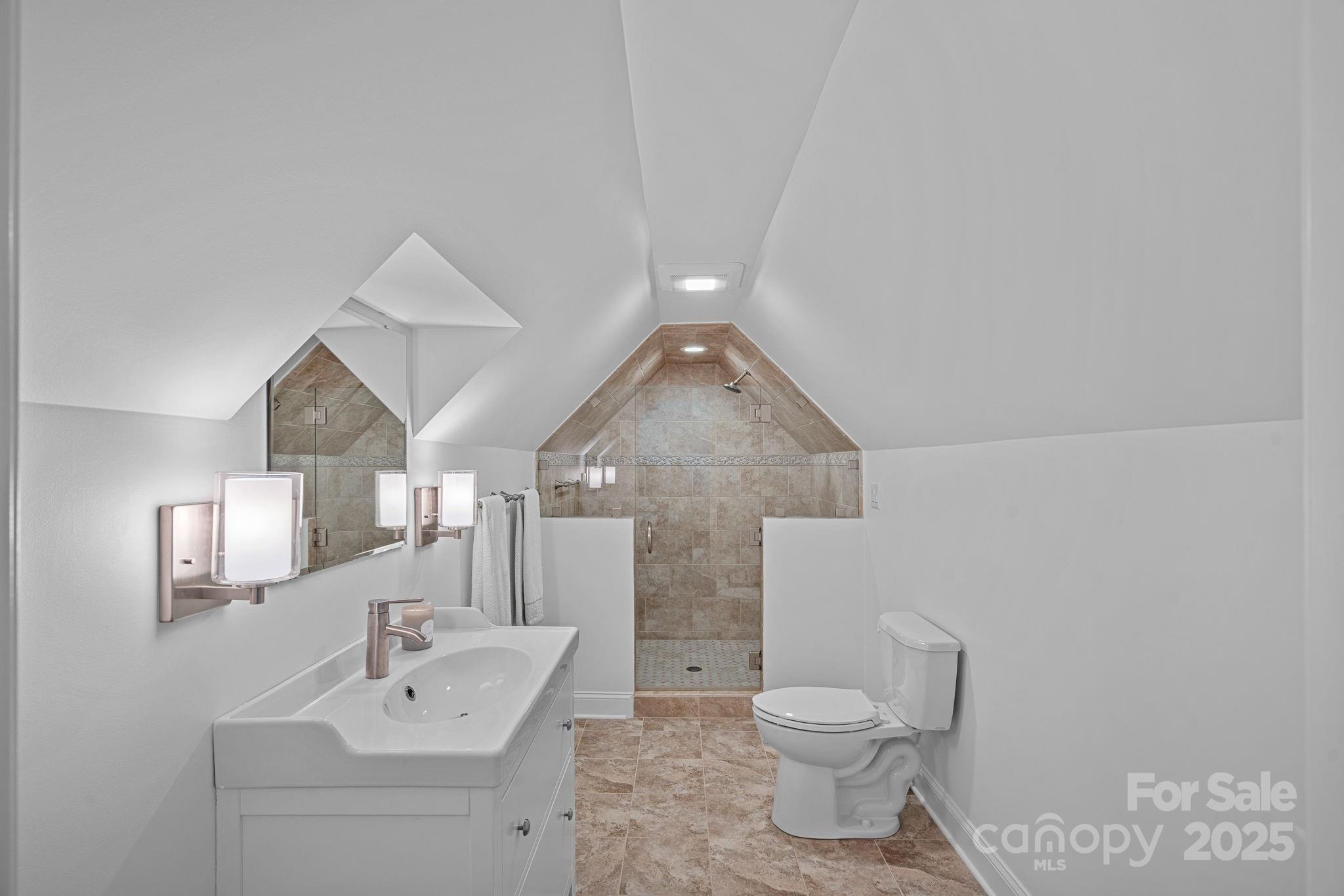 18613 John Connor Road Cornelius, NC 28031 - Photo 40 of 48 a bathroom with a toilet sink and mirror