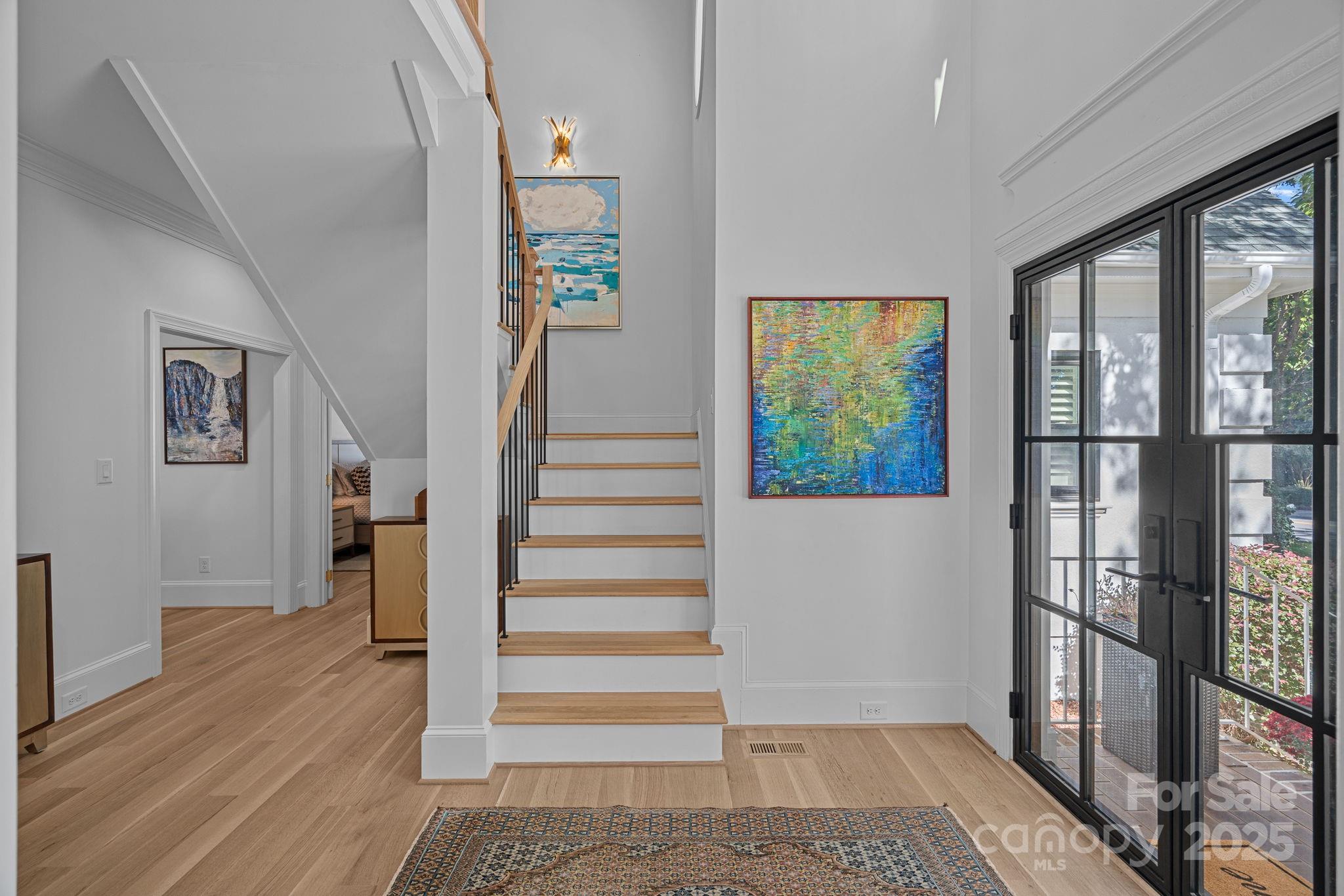 18613 John Connor Road Cornelius, NC 28031 - Photo 4 of 48 a view of entryway with wooden floor and door