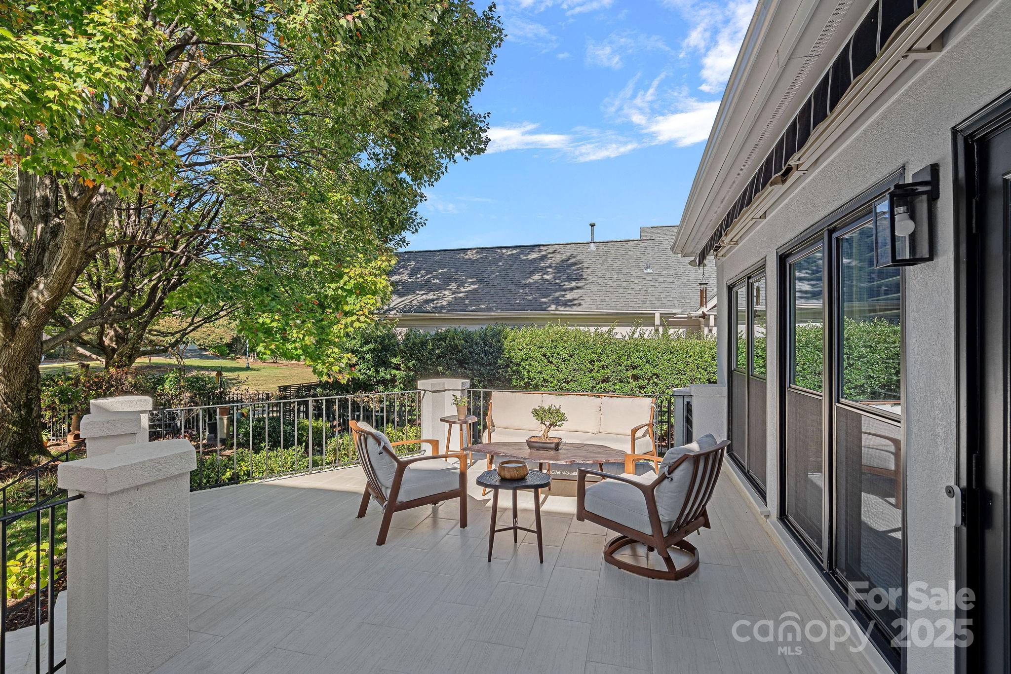 18613 John Connor Road Cornelius, NC 28031 - Photo 42 of 48 a view of a patio with a table chairs and a backyard