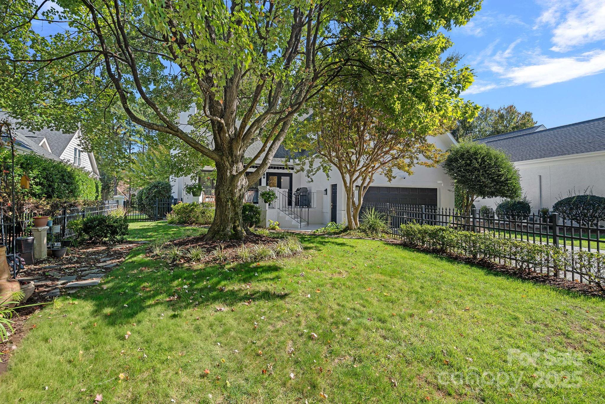 18613 John Connor Road Cornelius, NC 28031 - Photo 44 of 48 a front view of a house with garden