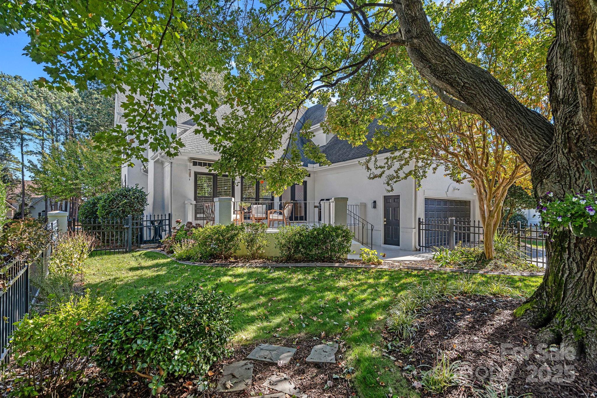 18613 John Connor Road Cornelius, NC 28031 - Photo 45 of 48 a front view of a house with garden