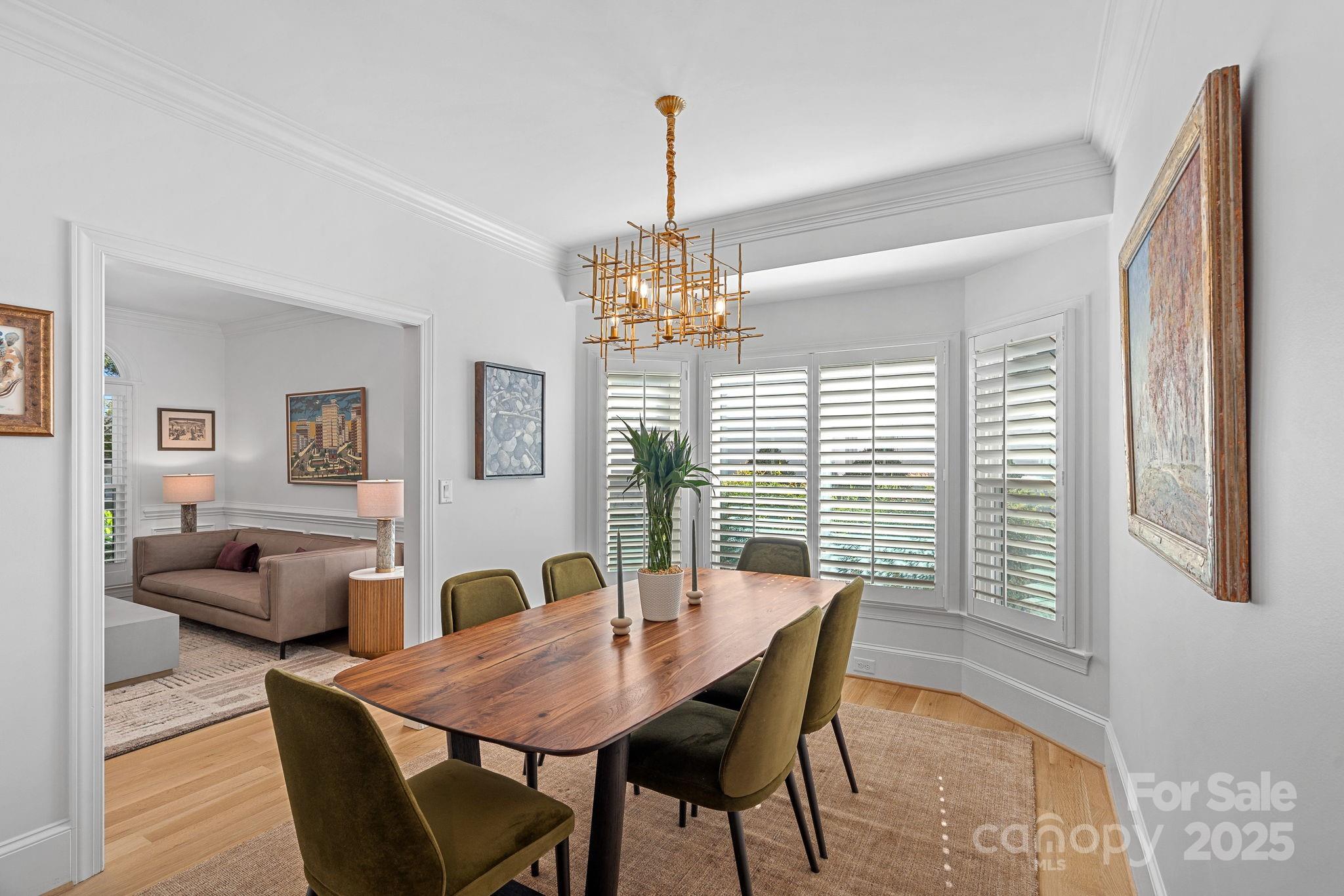 18613 John Connor Road Cornelius, NC 28031 - Photo 9 of 48 a view of a dining room with furniture window and wooden floor
