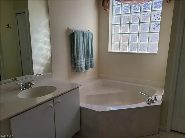a bathroom with a bathtub and a sink