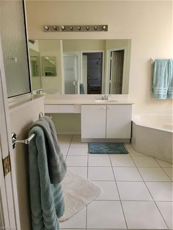 a bathroom with a sink and mirror