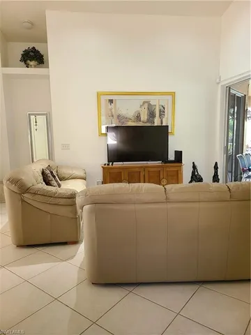 a living room with a couch and a fireplace