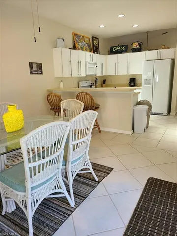 a kitchen with stainless steel appliances a refrigerator and a stove top oven