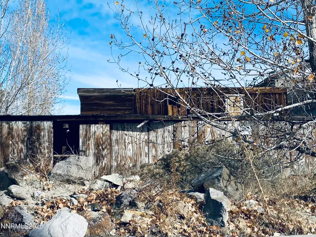 a view of a backyard of the house