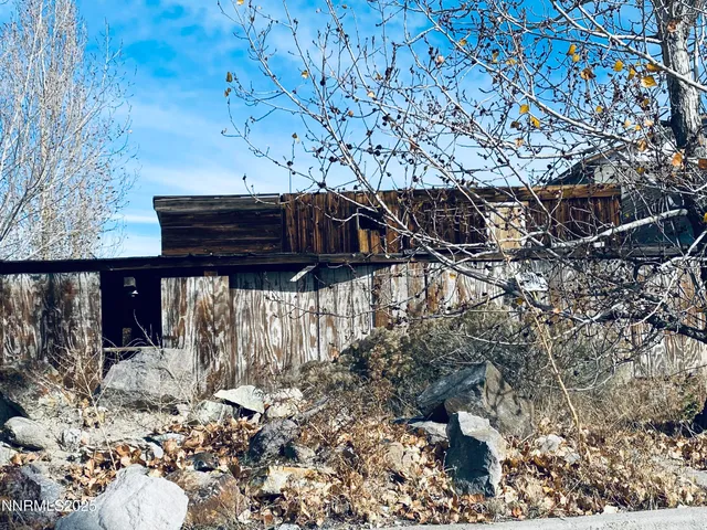 a view of a backyard of the house