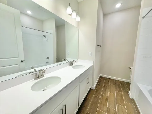 a bathroom with a sink and toilet