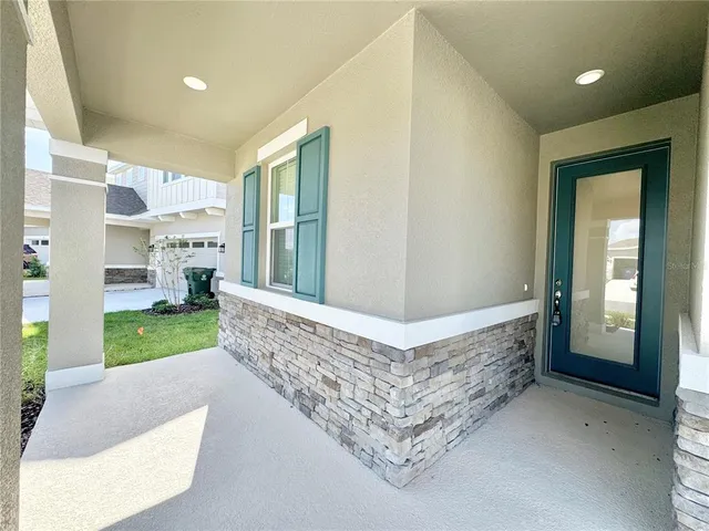 a kitchen with a refrigerator a stove top oven a sink and a center island