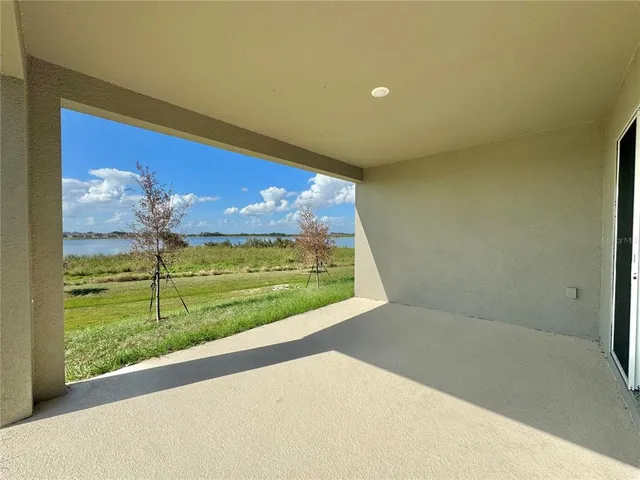 a view of a lake with a big yard