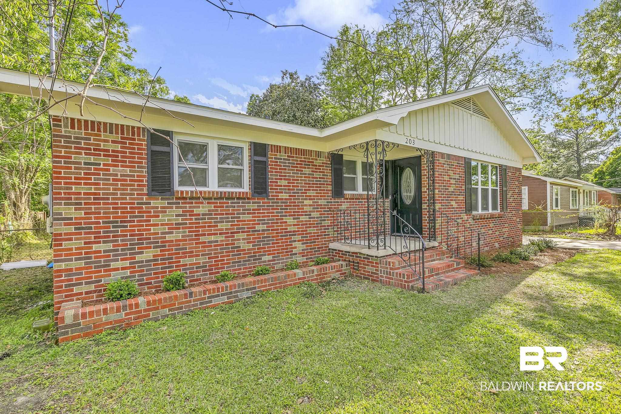 203 Anderson Road Saraland, AL 36571 - Photo 3 of 48 Ranch-style house with brick siding and a front lawn
