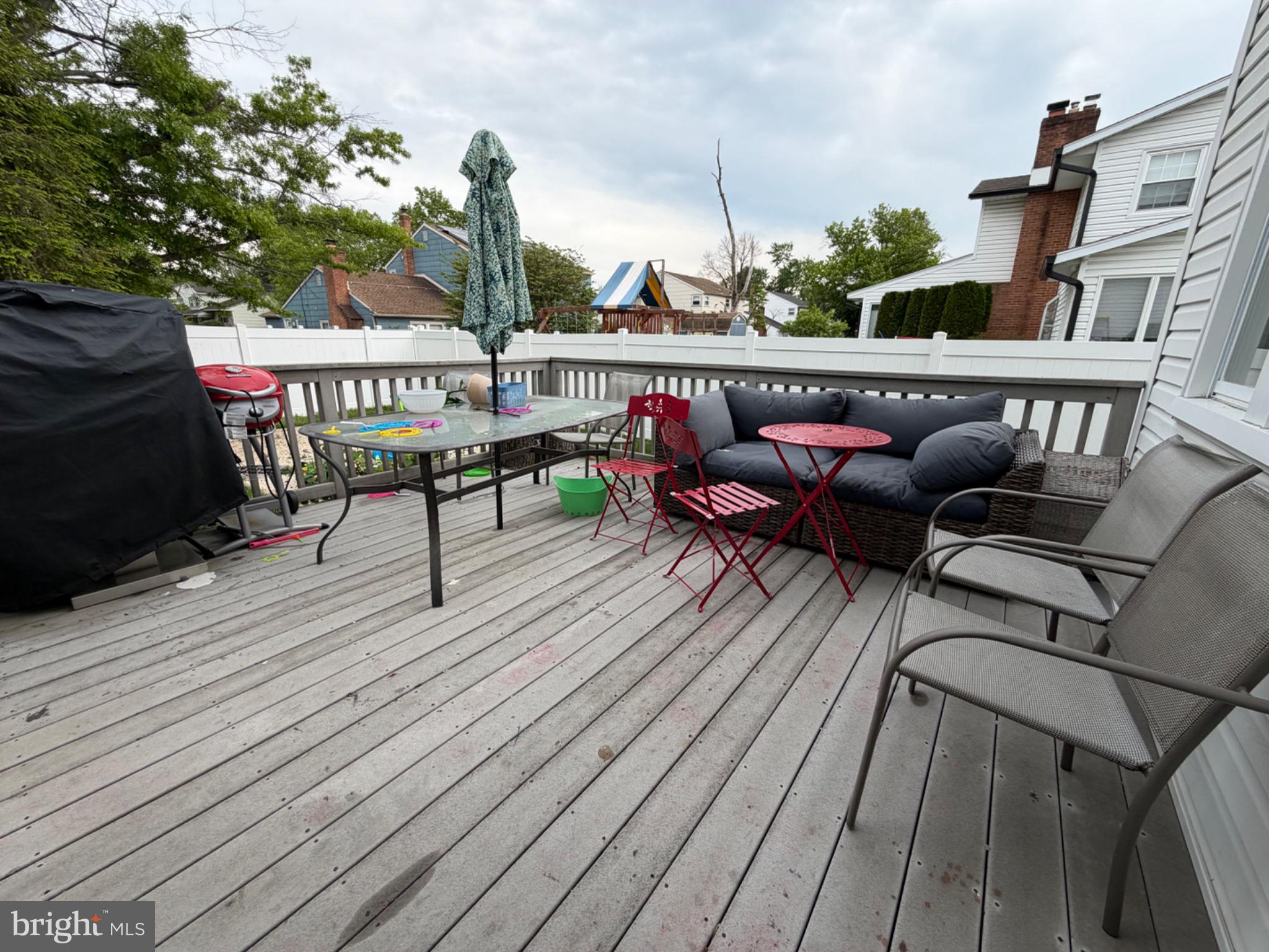 321 Surrey Road Cherry Hill, NJ 08002 - Photo 19 of 24 a roof deck view with table and chairs potted plants with wooden floor