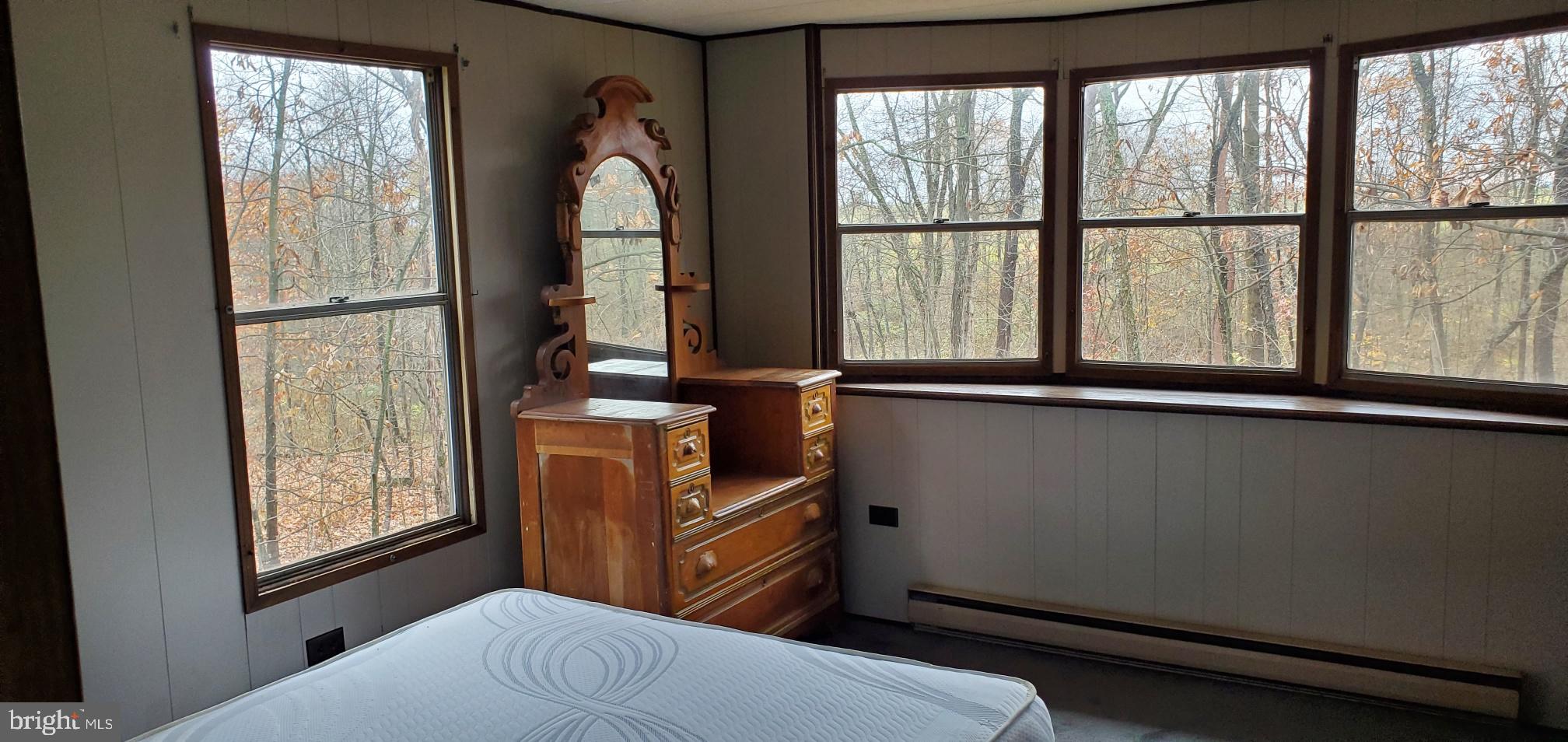 24 Waterloo Road Carlisle, PA 17015 - Photo 7 of 9 a bedroom with a bed and large windows