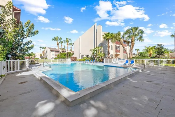 a view of swimming pool with outdoor seating