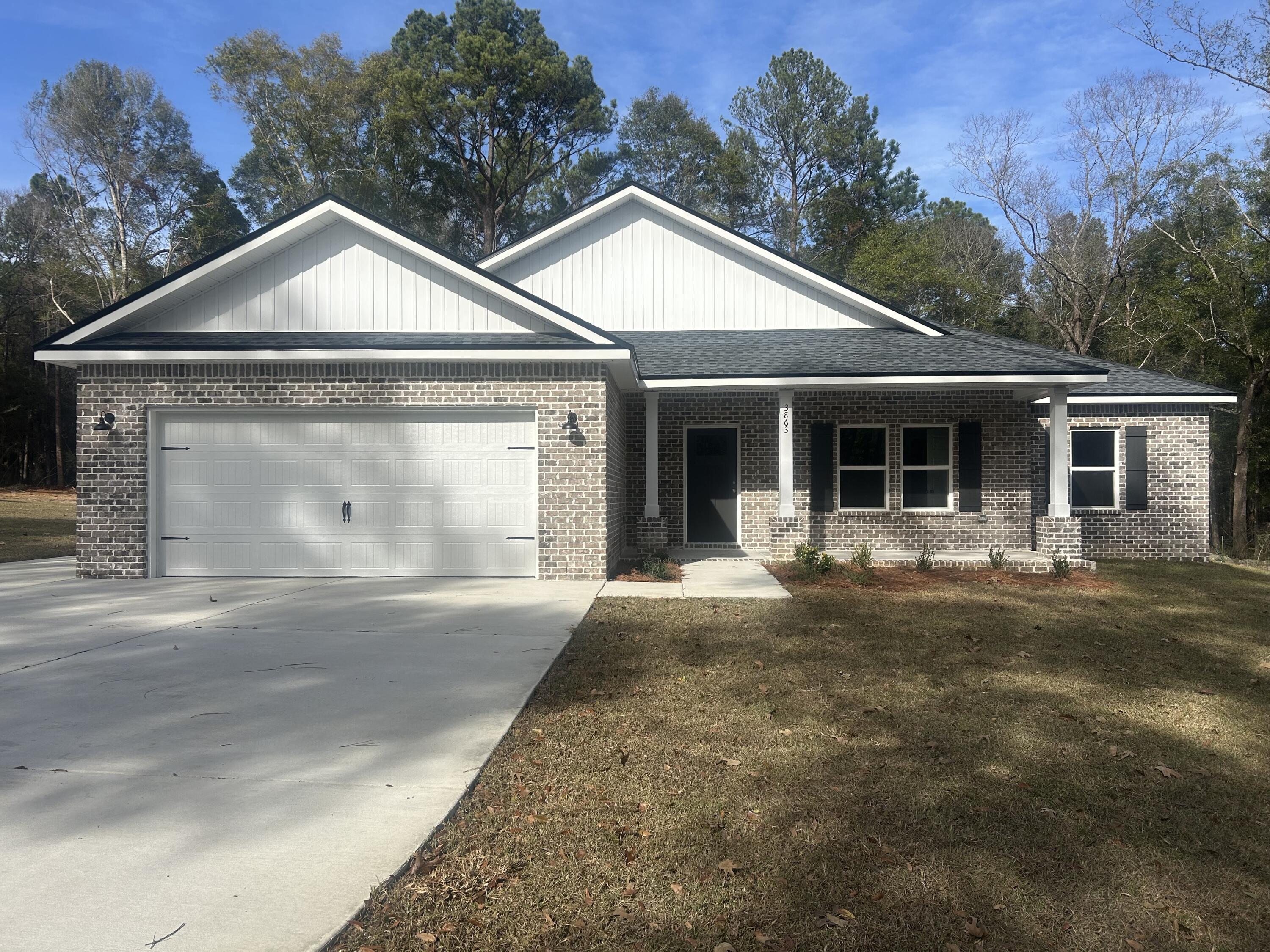 3863 Poverty Creek Road Crestview, FL 32539 - Photo 1 of 31 a front view of a house with yard